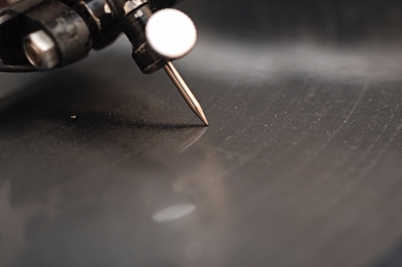 old gramophone needle and a black vinylの写真素材