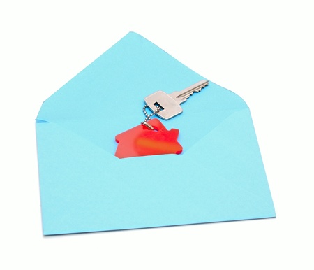 house symbol and key in open envelopeの写真素材