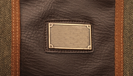 metal label on old black leather background
の写真素材