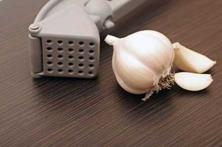 Garlic press and garlicの写真素材