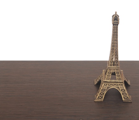 eiffel tower statue on wooden background