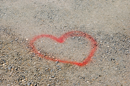 Love heart painted on the street asphalt の写真素材