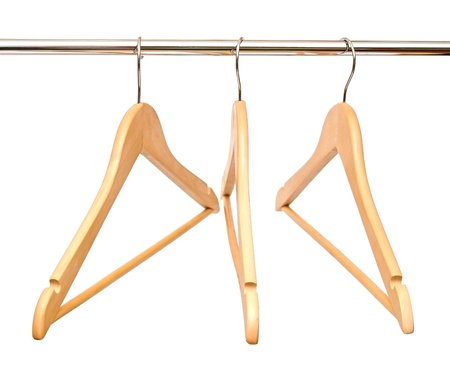 Group of empty wooden hangers isolated on white backgroundの写真素材