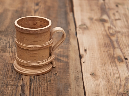Wooden cup on old wooden tableの写真素材