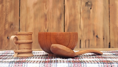 Wooden kitchen utensils on wooden tableの写真素材