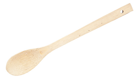Close-up top view of wooden spoon isolated over whiteの写真素材
