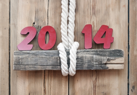 2014 numbers hanging by rope on woode sign の写真素材
