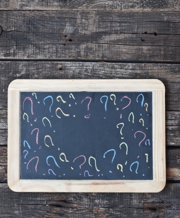 hand drawn question marks on small chalkboardの写真素材