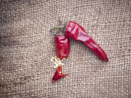 red chilli peper on worn hessian backroundの写真素材