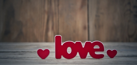 Word ''love'' on a old wood planks. の写真素材