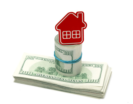 red home sign on hundred dollar bills. Real Estate business Concept  の写真素材