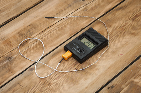 Digital thermometer on wooden table topの写真素材