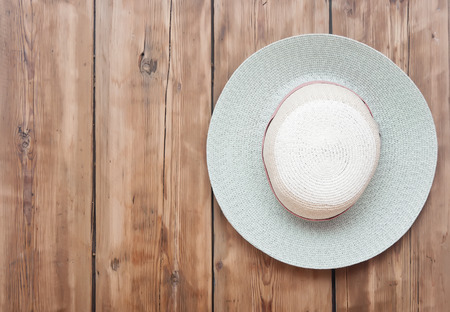 Hat hanging on an old wooden wall.の写真素材