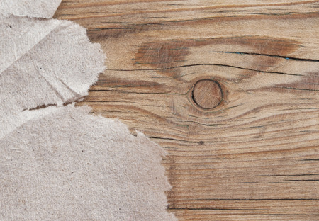torn paper on woodの写真素材