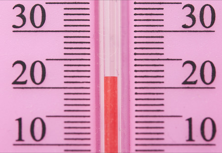 Closeup photo of household alcohol thermometer showing temperature in degrees Celsiusの写真素材