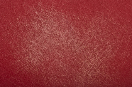 Scratched red backgroundの写真素材