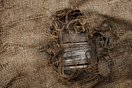background of burlap with a hole for writing text. texture of the woodの写真素材