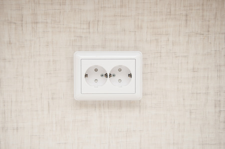 White electric socket on the wall. Close upの写真素材