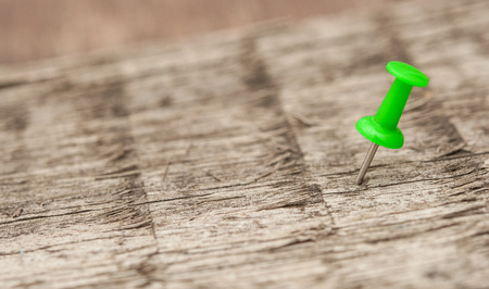 push pin on wooden boardの写真素材