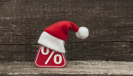 Symbol of percent and a christmas hatの写真素材