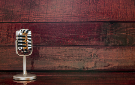 Retro microphone on wooden tableの写真素材