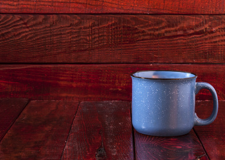 colorful cups on the wooden backgroundの写真素材