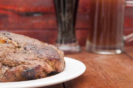 grilled meat and mug of beerの写真素材