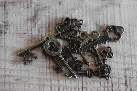many different keys on vintage backgroundの写真素材