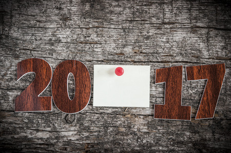 Happy new year 2017 on wood background