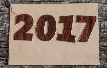 Happy new year 2017 on wood background