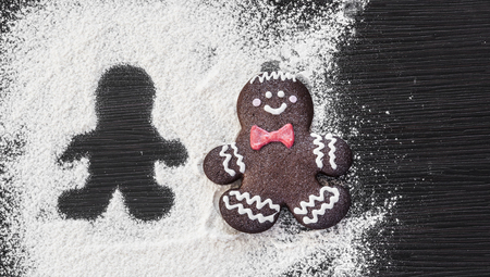 Christmas homemade gingerbread cookies on wooden table