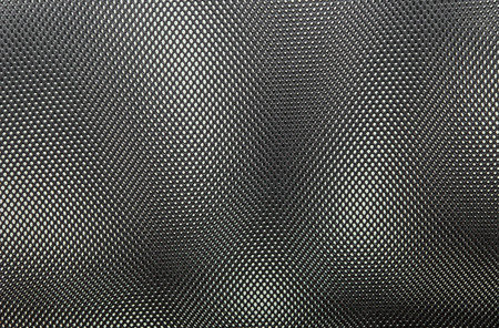 black  fishnet cloth material as a texture backgroundの写真素材