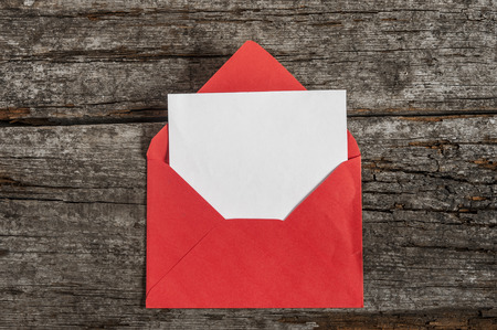 red envelopes with blank card on wooden backgroundの写真素材