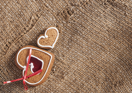 close-up of gingerbread in the shape of hearts on old burlapの写真素材