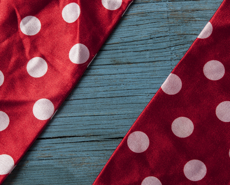 vintage wooden background with red polka dot ribbonの写真素材