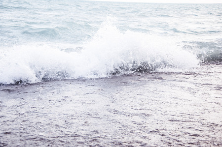 Wave on a pebble beachの写真素材