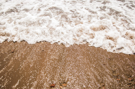 Soft wave of the sea on the sandy beachの写真素材