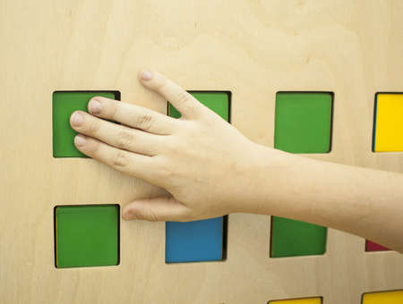 Kid hands playing of cubesの写真素材