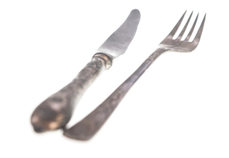 Vintage fork and knife isolated on white