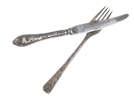 Vintage fork and knife isolated on whiteの写真素材
