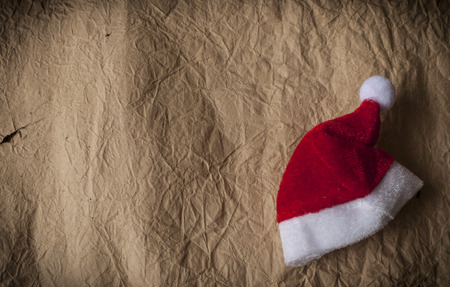 Classic red Christmas Santa hat on grunge paper textureの写真素材