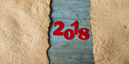 numbers forming the number 2018, for the new year 2018 on rustic wooden background with christmas...