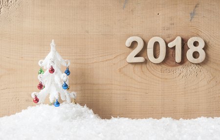 Wood numbers forming the number 2018, snow and christmas decoration.の写真素材