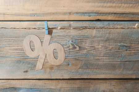 percent discount icon symbol on a wooden backgroundの写真素材