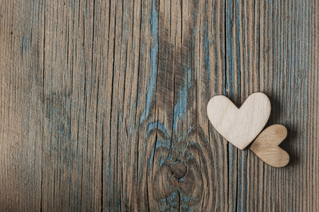 two wooden heart on vintage wood backgroundの写真素材