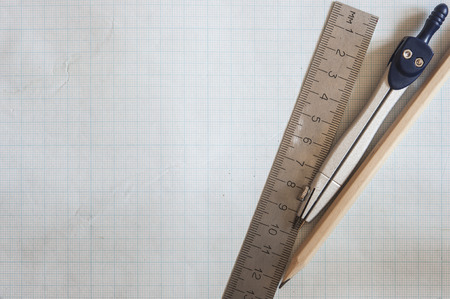 Geometry set with compass, ruler on graph paper