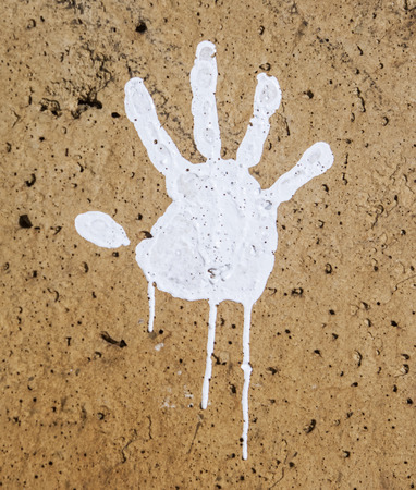 white imprints of human hands on wall concreteの写真素材