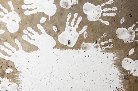 white imprints of human hands on wall concreteの写真素材