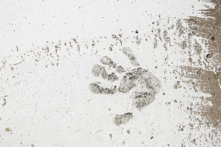 white imprints of human hands on wall concreteの写真素材