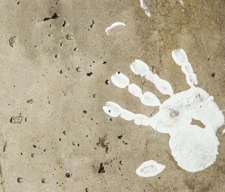 white imprints of human hands on wall concreteの写真素材